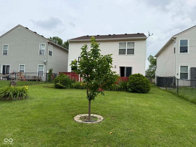 rear view of property with a fenced backyard | Image 6