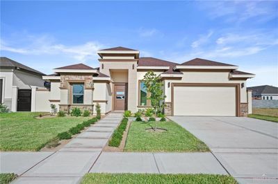 Prairie-style house with a garage and a front lawn | Image 3