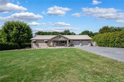 Built in 1998 by Ralph Bachman, this all-brick home just recently had a new, metal roof installed on all structures on the grounds. All-plaster walls and ceilings by Zino Smith. | Image 1