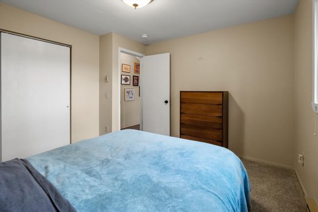 Carpeted bedroom with baseboards and a closet | Image 20