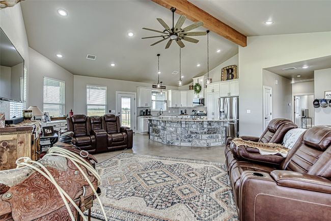 Living area with ceiling fan & beam ceiling | Image 9