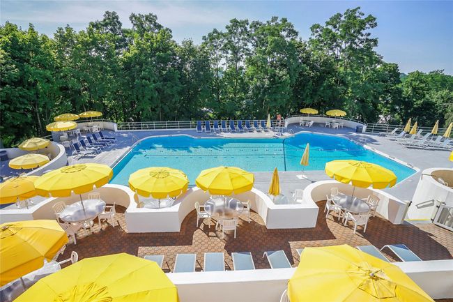 View of swimming pool featuring a patio | Image 35