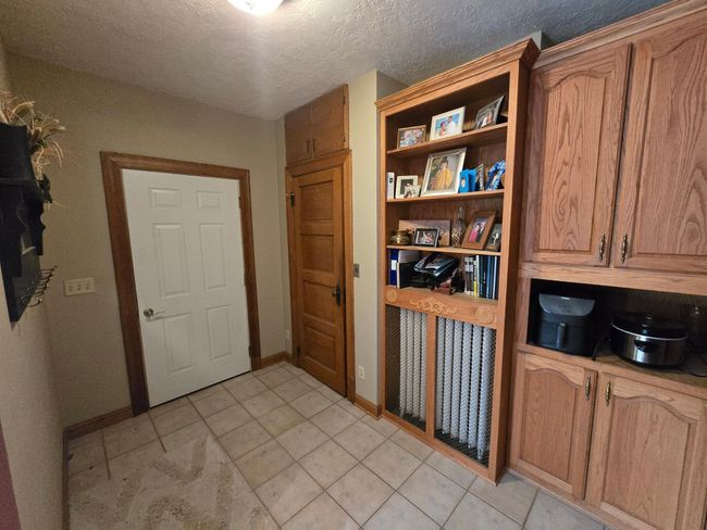 Door from garage. Closet & shelving & cabinets | Image 20