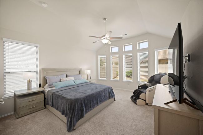 Step into the sanctuary of theprimary bedroom. Soft carpetingunderfoot adds a touch of luxury, creating a warm and invitingatmosphere that extends throughoutthe space. | Image 19