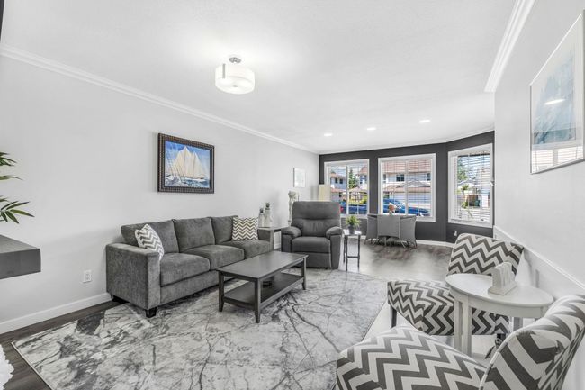 Living room featuring ornamental molding, baseboards, recessed lighting, and wood finished floors | Image 9