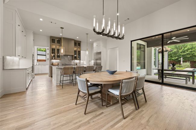 Dining area lots of natural light, white oak floors | Image 7