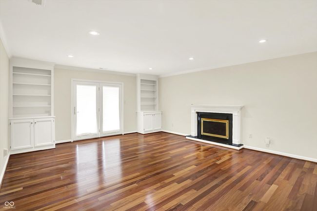 Great room with built in bookshelves and extra storage | Image 14