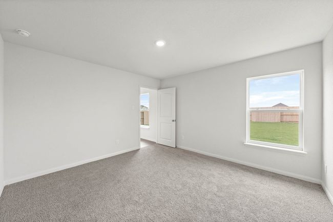 Spare room with plenty of natural light, carpet flooring, and recessed lighting | Image 7