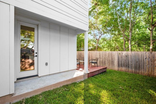 View of fenced backyard | Image 6
