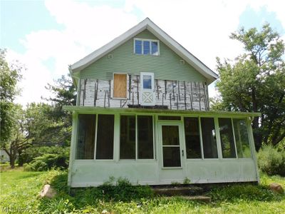 Back of house with a sunroom | Image 2