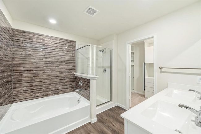 Primary bath room w/ separate tub and shower | Image 18