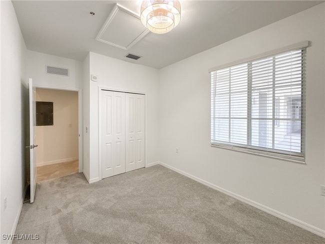 Unfurnished bedroom with light carpet, a closet, and baseboards | Image 21