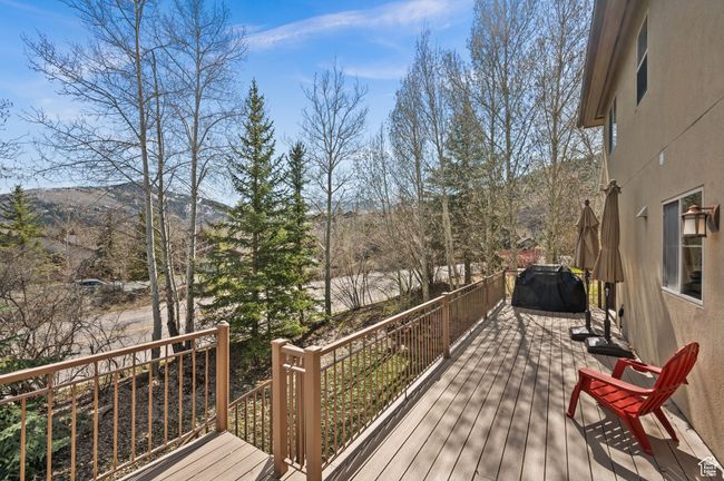 Wooden deck featuring a mountain view | Image 34