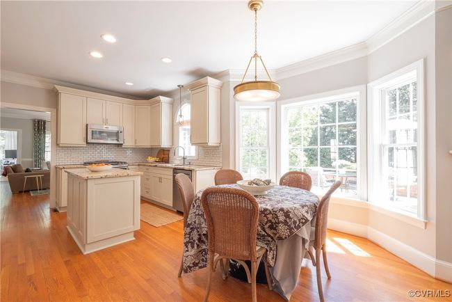 Dining room featuring crown molding, baseboards, recessed lighting, and light wood-style flooring | Image 20