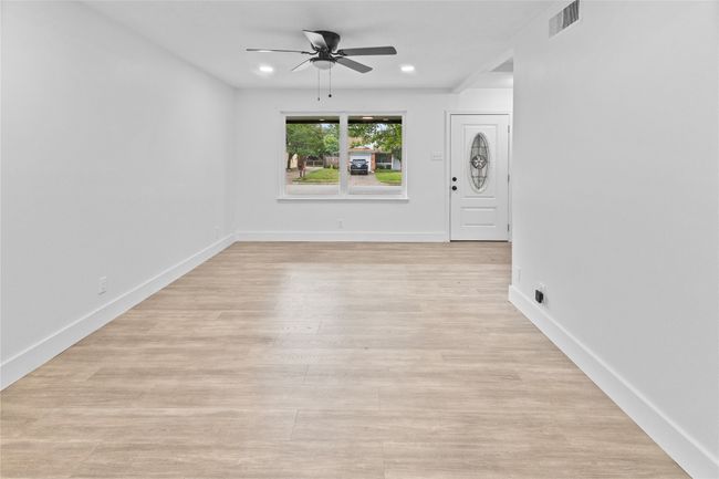 Empty room featuring a ceiling fan, light wood-style floors, recessed lighting, and baseboards | Image 21