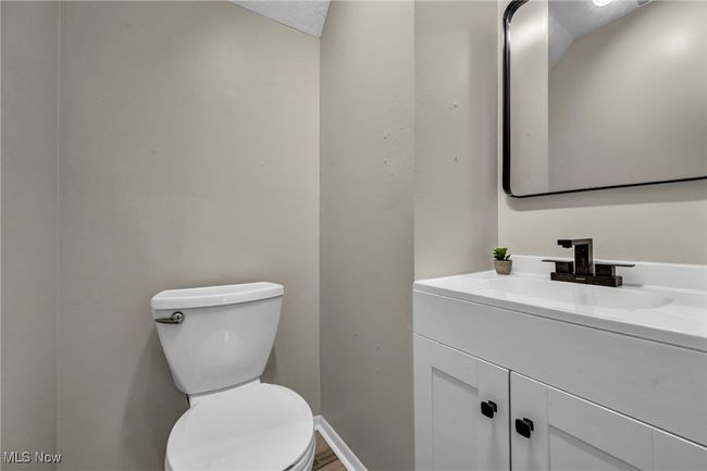 Half bath featuring vanity and toilet | Image 30