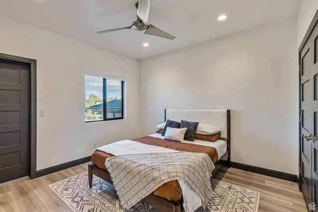 Bedroom featuring recessed lighting, light wood-style flooring, and baseboards | Image 58