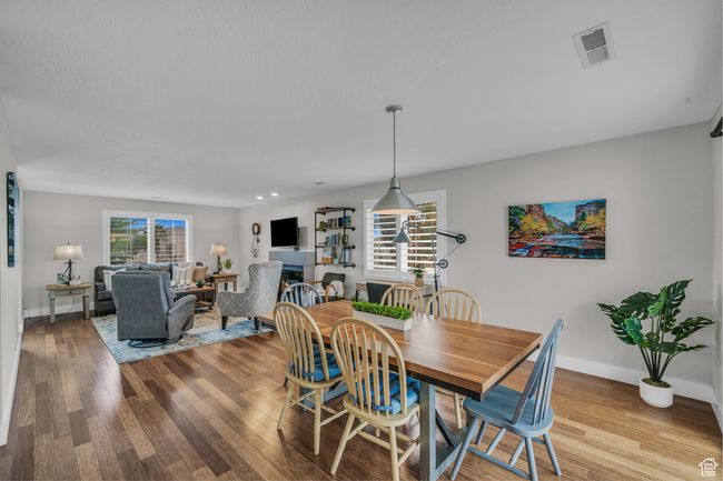 Dining area with wood finished floors and baseboards | Image 10