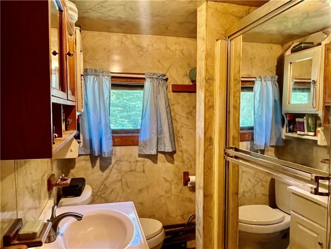 Bathroom featuring sink and toilet | Image 6