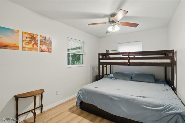 Bedroom featuring light wood-type flooring and ceiling fan | Image 26