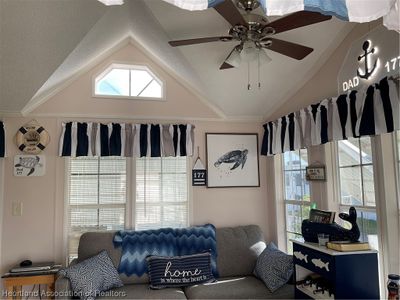 Living room features high ceilings | Image 2