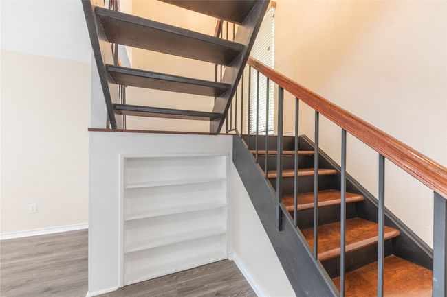 Stairs with wood finished floors and baseboards | Image 24