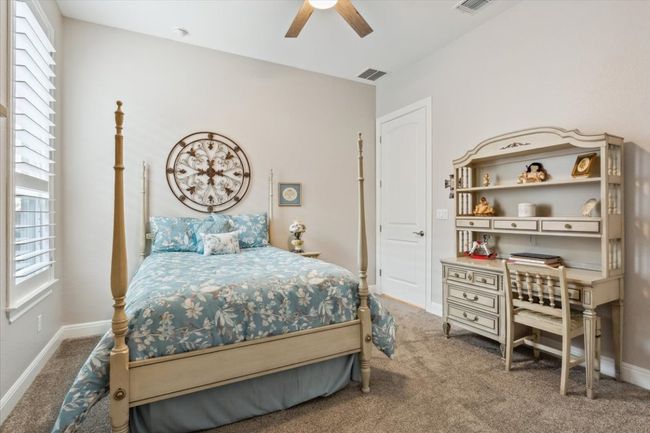 Guest bedroom with walk in closet and ceiling fan | Image 26