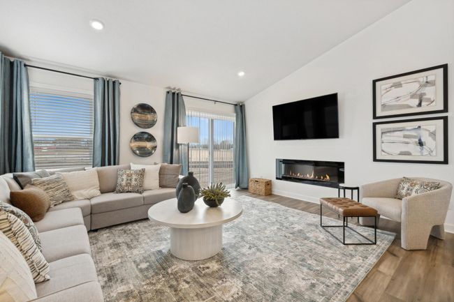 (Photo of decorated model, actual home's finishes may vary slightly) The great room is cozy and contemporary. | Image 6