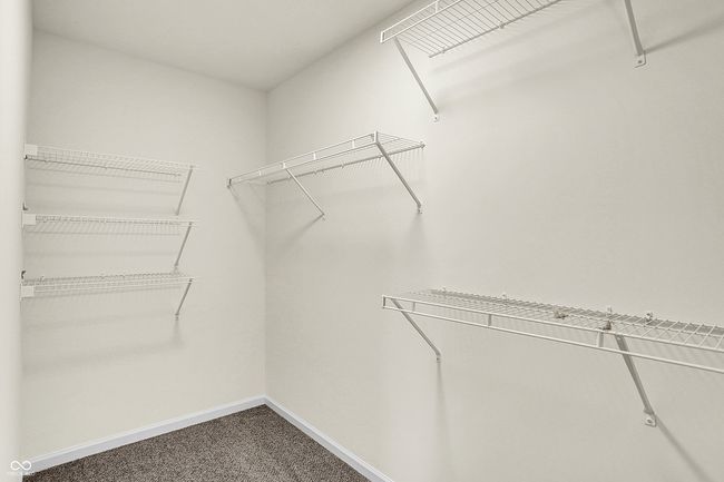 walk in closet with carpet | Image 26