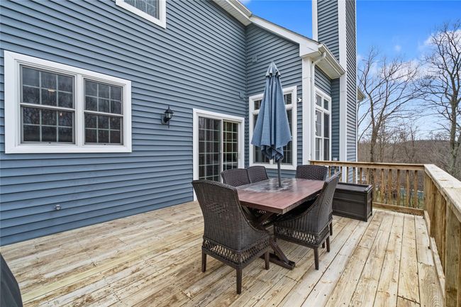 Wooden deck with outdoor dining area | Image 36
