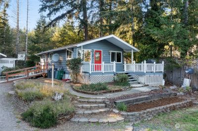 Nice brick pathway leading up to your partially covered patio. | Image 3