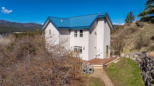 Back of house featuring a deck with mountain view and metal roof | Image 53