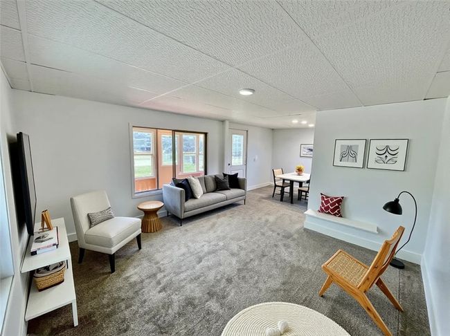 Living Room-The furnishings and decor shown have been virtually staged. | Image 6