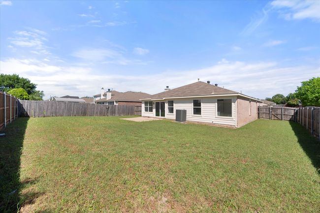 Rear view of house featuring central air condition unit and a patio area | Image 26