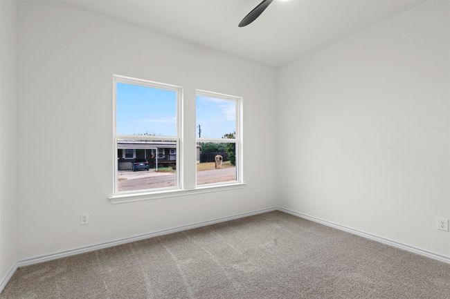 Empty room with carpet flooring and ceiling fan | Image 27