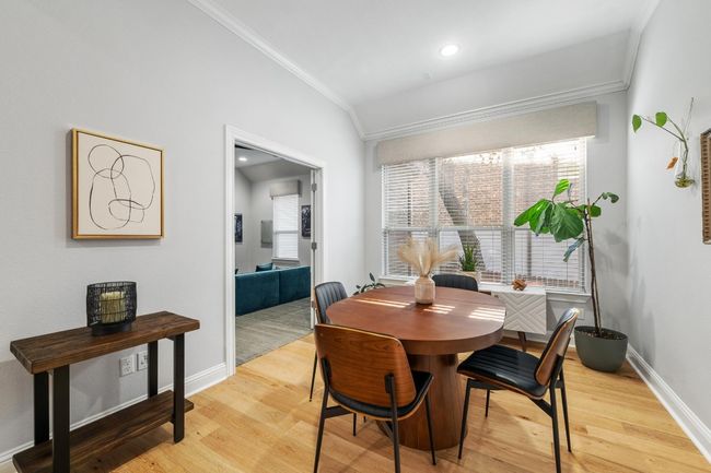 The cozy breakfast room offers lovely views, high ceilings and plenty of wall space to hang art. The lighting is great for houseplants. | Image 18