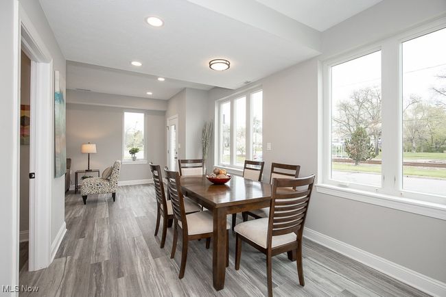 Dining area featuring a healthy amount of sunlight and light hardwood / wood-style flooring | Image 13