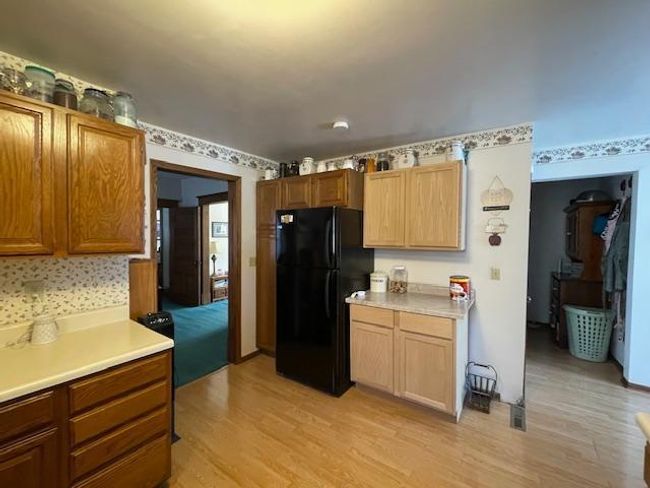 Pantry next to refrigerator and new cabinets | Image 15