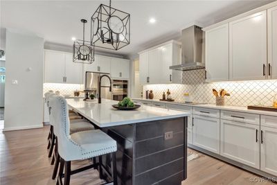 You'll love the chef's kitchen in the Cove floor plan! HOME IS UNDER CONSTRUCTION - Photo is from builder's library and shown as an example only. | Image 1