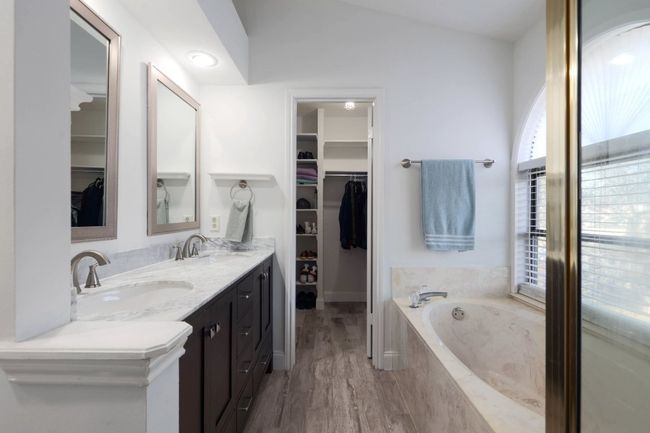 The ensuite bath is like a spa getaway right at home, with a double vanity that provides plenty of space for getting ready without feeling crowded | Image 19