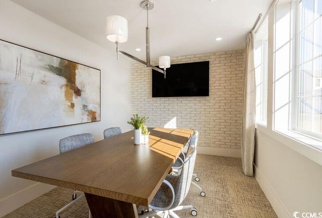 Dining space with recessed lighting, baseboards, and brick wall | Image 18