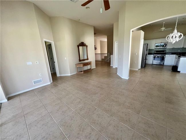 Living room view to kitchen and dining now with furniture moved out | Image 11
