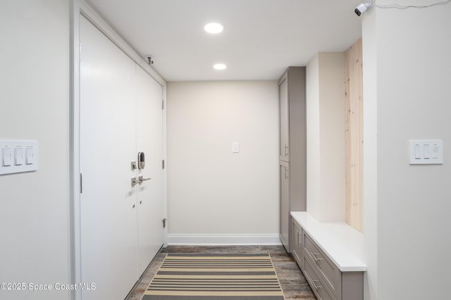 Automatic light as you enter, drop zone with built in cabinets. | Image 12
