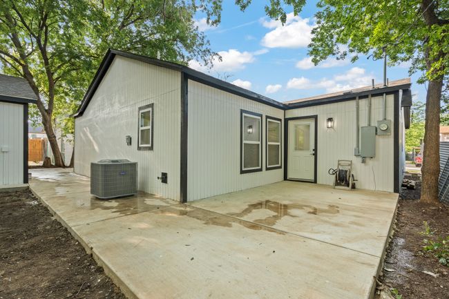 Rear view of house featuring cooling unit and a patio | Image 21