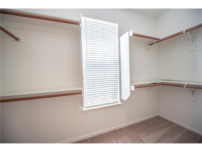 Walk in closet featuring carpet | Image 16