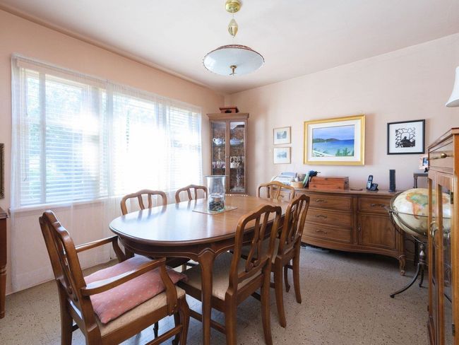 Dining space featuring light floors and baseboards | Image 8