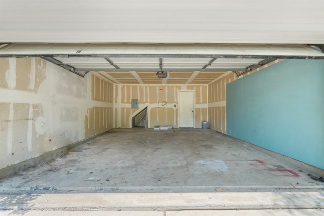 Garage with a garage door opener and electric panel | Image 5