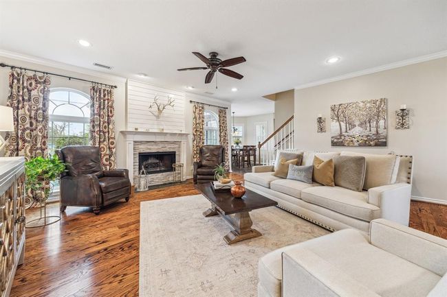 Cozy up by the fireplace while enjoying stunning park views. | Image 9
