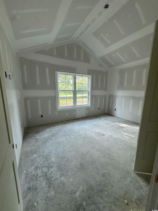 Empty room featuring lofted ceiling | Image 26