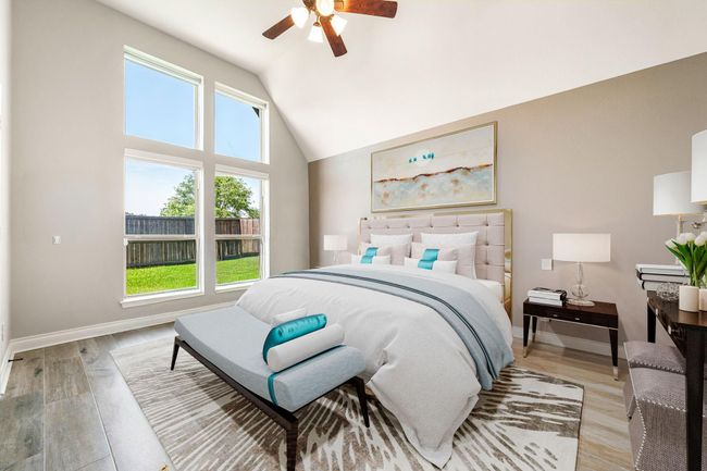 Secondary bedroom features tile flooring, neutral paint, dark stained ceiling fan with lighting and a large window with privacy blinds. | Image 24